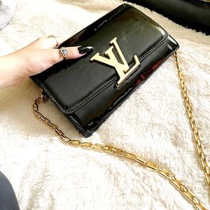 Louis Vuitton side clutch bag with red interior
